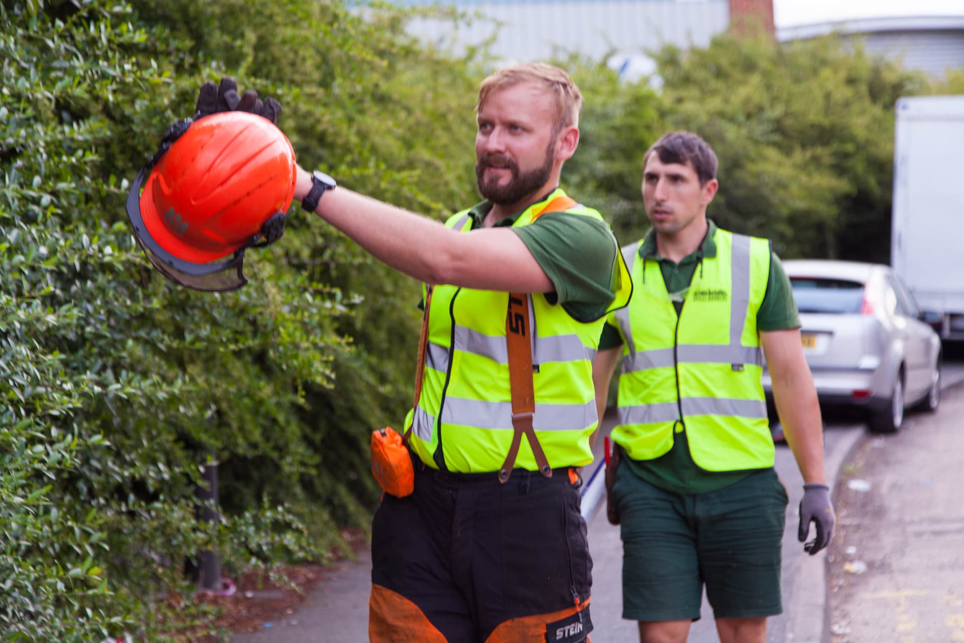 Grass Barbers professional hedge trimming team on site in London