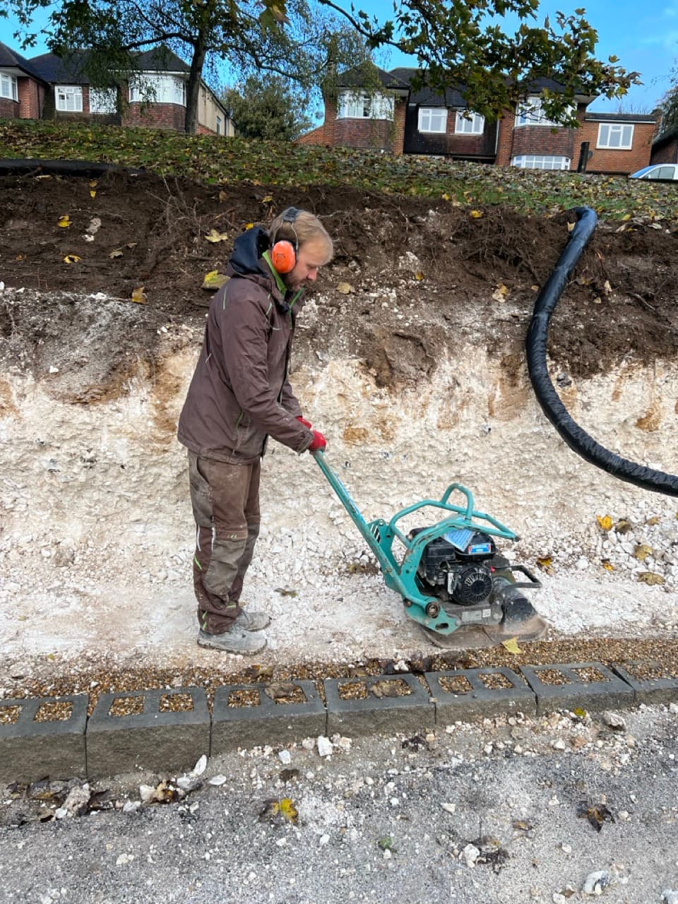 Grass Barbers technical team performing site assessment and groundwork preparation in Surrey